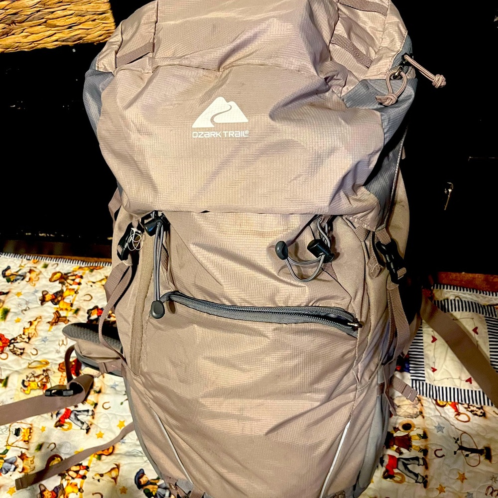 Ozark trail, 50L beige and gray hiking backpack.
